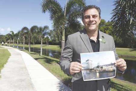 man holding picture of building
