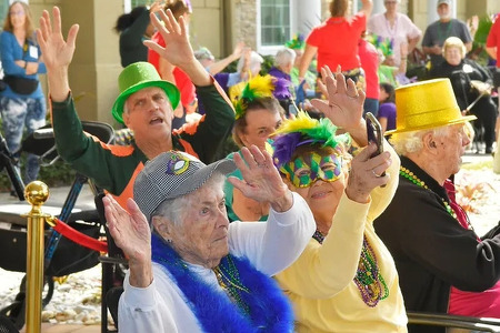 Senior residents enjoying Mardi Gras celebration