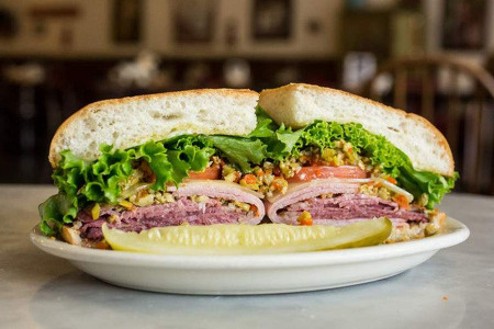 Sandwich on a plate with a pickle