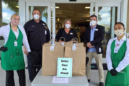 Florida Today employees handing out free lunch