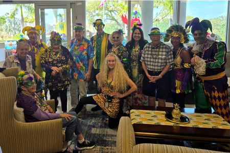 senior residents dressed in costumes for Mardi Gras