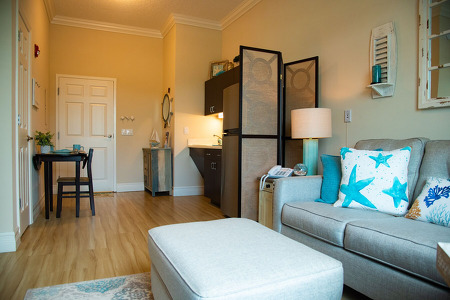 small living apartment with a couch and a view of the front room