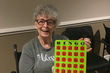 Resident Showing off a Bingo Card