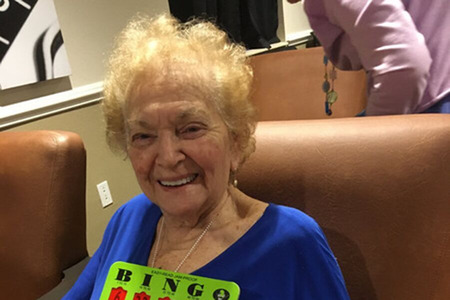 Happy Resident with Bingo Card