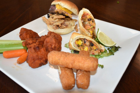 Legends Sampler Platter - Cheeseburger slider, Santa Fe chicken egg roll, boneless wings and mozzarella sticks