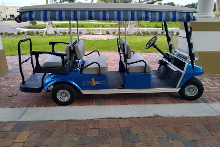 large golf cart with three rows of seating
