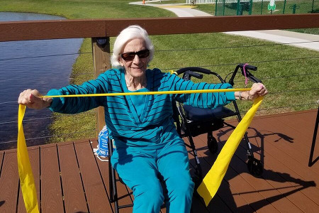 Senior woman with yellow ribbon