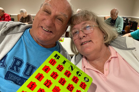 man and woman playing bingo
