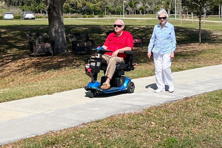 Senior husband and wife walking on path