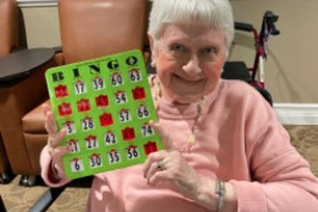 Resident enjoying her bingo win