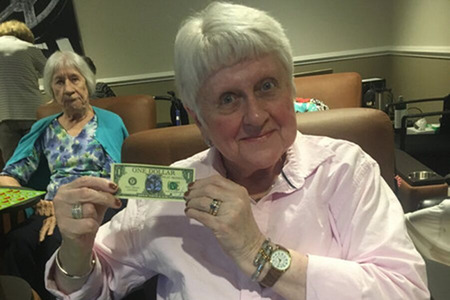 Happy Resident Holding Fake money