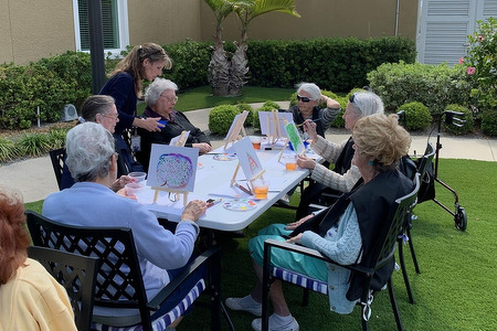 senior ladies painting outdoors
