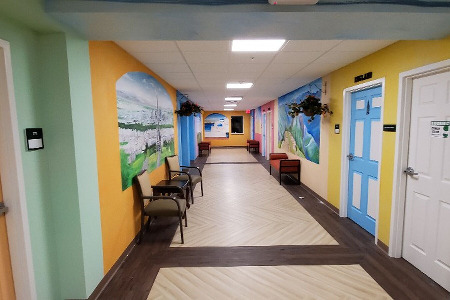 Multi-colored hallway with multiple doors