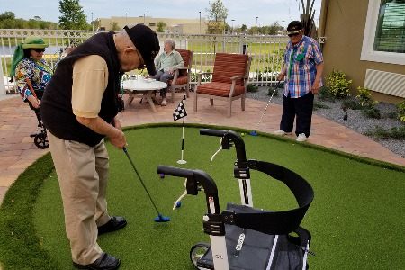 Seniors playing mini-golf