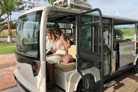 Man and woman sitting in the back of a tram
