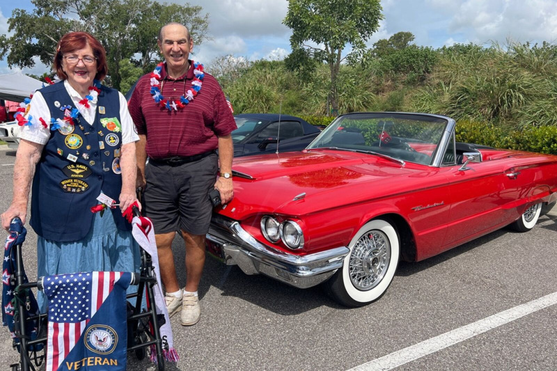 Senior man and woman at car show