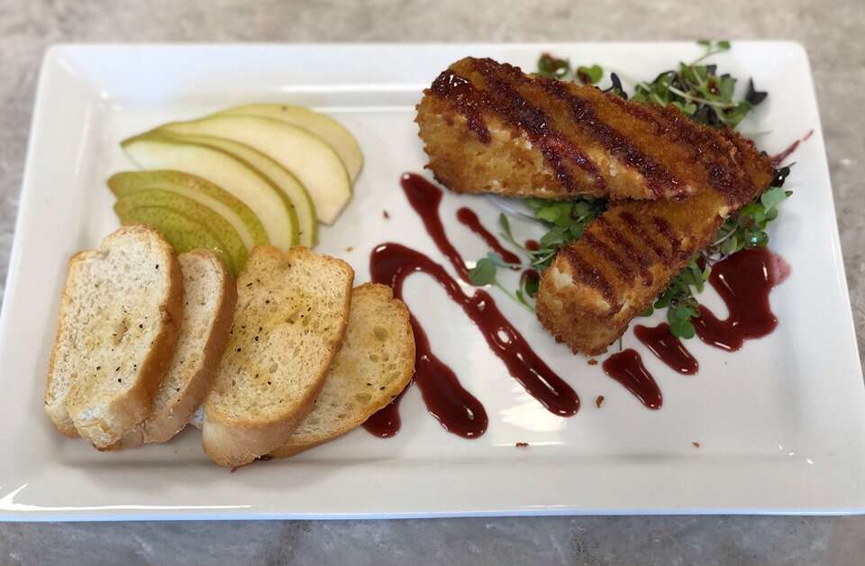 gourmet food on a plate very neatly set out ready to devour